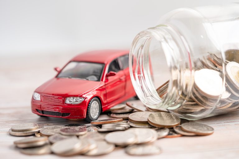 Car on coins background; Car loan, Finance, saving money, insurance and leasing time concepts.