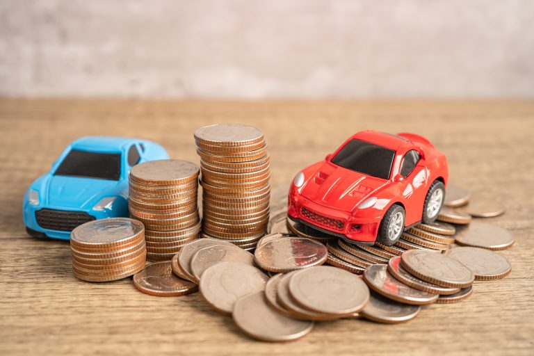 Cars and coins, Car loan, Finance, saving money, auto insurance and leasing time concepts.