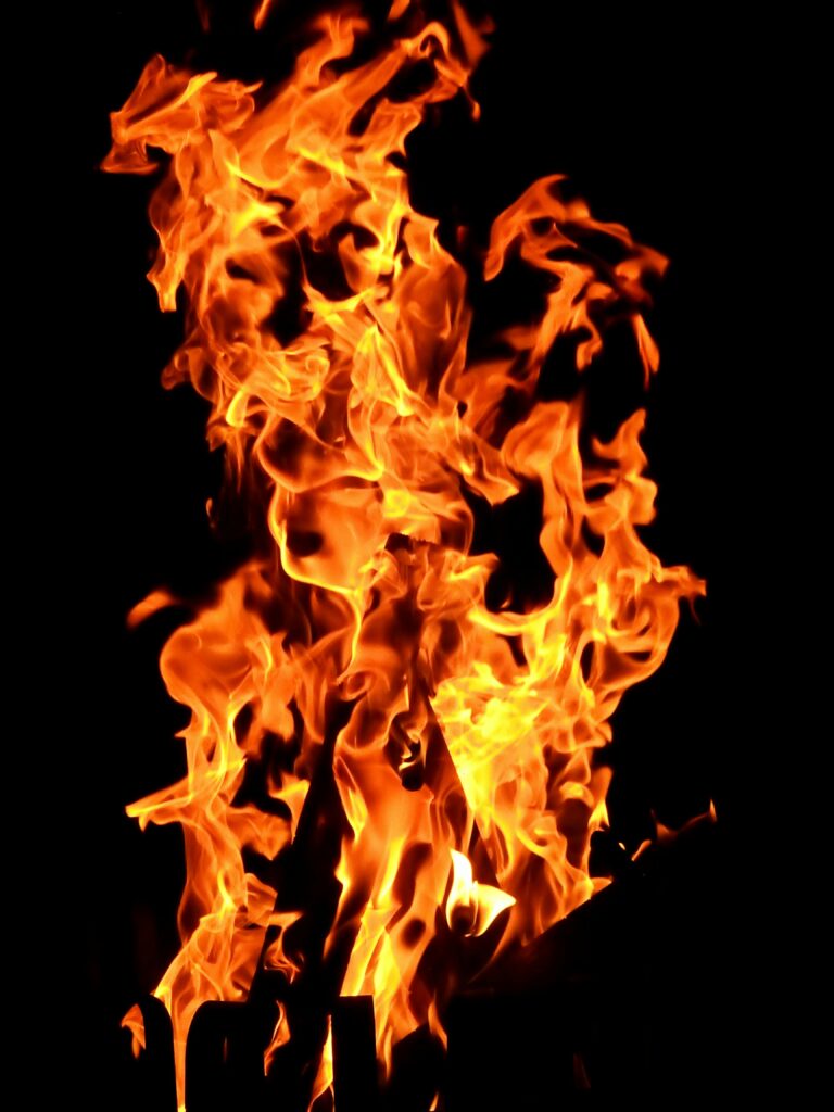 Bright orange flames against a black background, illustrating the intensity and danger of lithium-ion battery fires, which can ignite suddenly and spread rapidly due to thermal runaway.